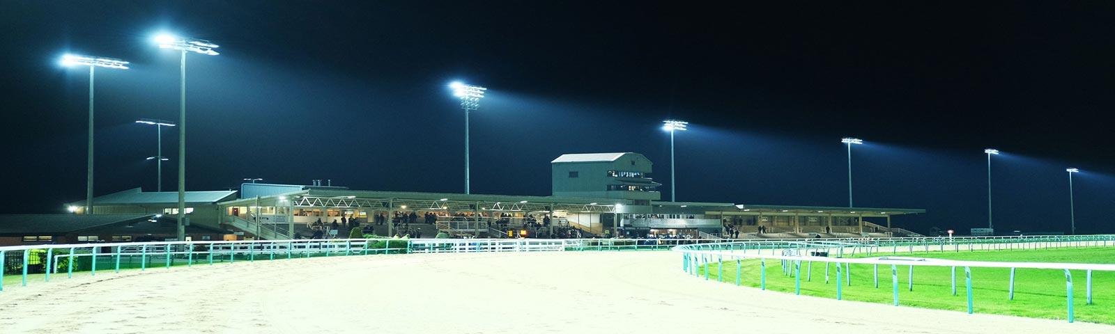 Southwell Racecourse floodlit at night