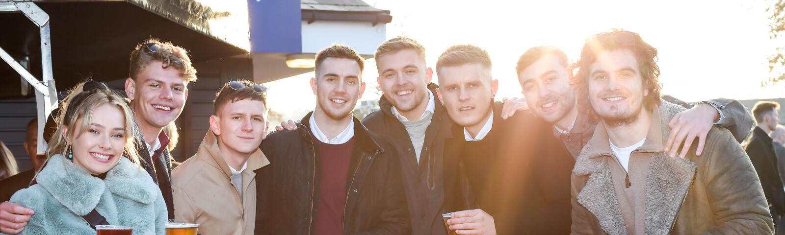 A large group of friends enjoy the races at Southwell