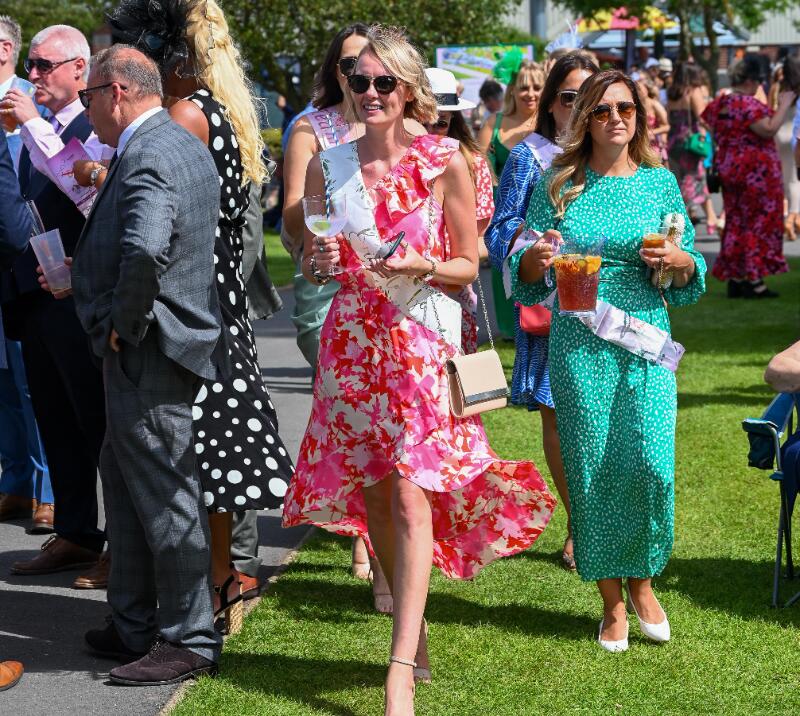 A bride to be and her hen party strolling through Southwell Racecourse 