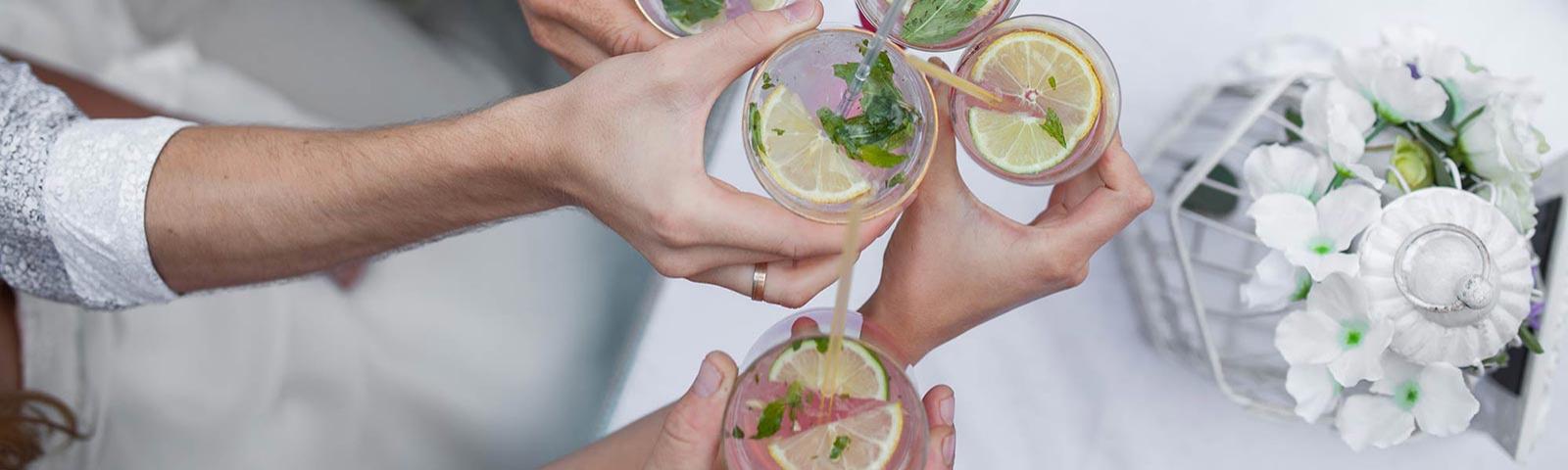 Friends raising a drink together, a view from above.
